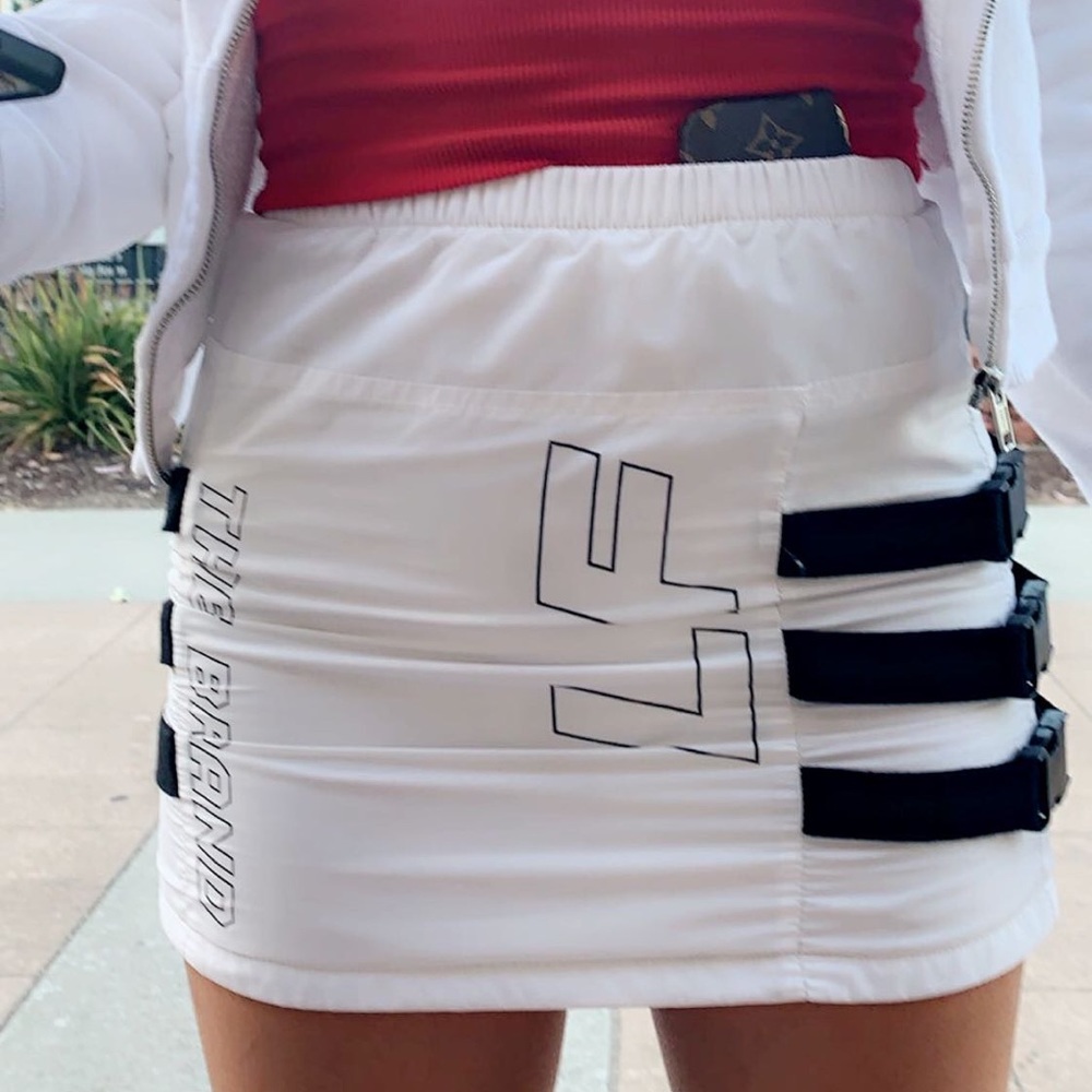 white LF mini skirt w/ black buckles